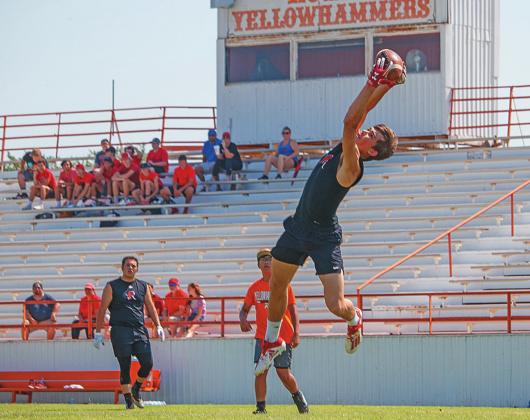 Pigs don't fly when Lions Leap: Roby Senior Gunner Helm makes a leaping grab to score in this past weekend's 6-on-6 Football Tournament hosted by the Rotan Athletic Booster Club. (Photo by Mark Martinez) More photos and results on Page 9